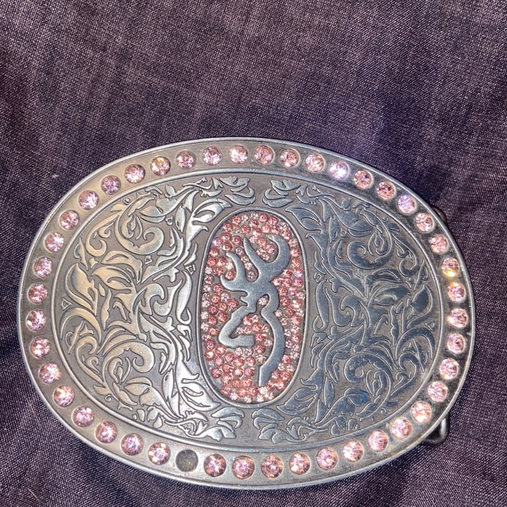 Browning Buck mark silver plated belt buckle with pink rhinestones.